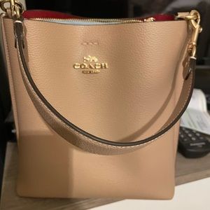 Coach tan bucket bag